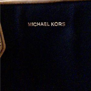 Michael Kors crossbody and hand strap carry bag/ purse.